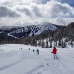 People skiing in Big Sky on a Montana winter vacation.